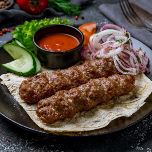 Mutton Kebab (2/4 Strips + 1Bread+Hummus+ Mayonnaise)30.00/52.00AED